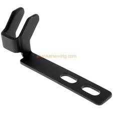 Belt shifter button hole